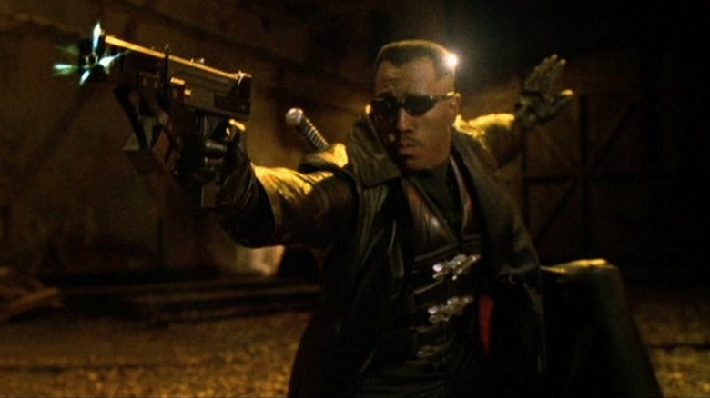 Blade shoots a machine gun in "Blade II" (2002)