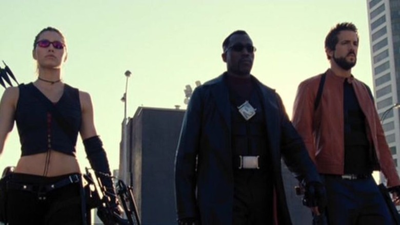 Blade, Hannibal, and Jessica Biel walk on a rooftop