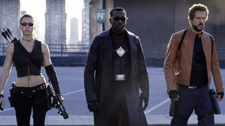 Blade, Hannibal, and Abigail walk on a rooftop in "Blade: Trinity" (2004)