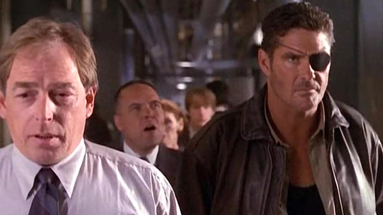 Fury and Dugan lead politicans down a corridor in "Nick Fury, Agent of SHIELD" (1998)