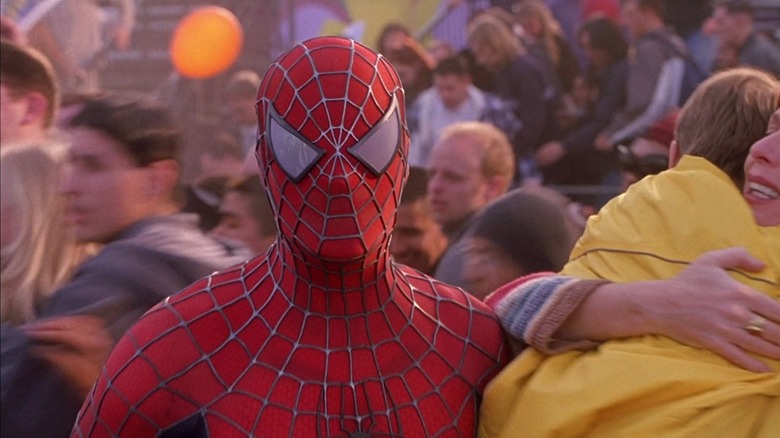 Spider-Man stands in a crowd