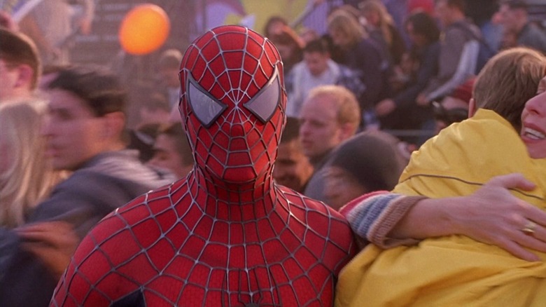 Spider-Man stands in a crowd in "Spider-Man" (2002)