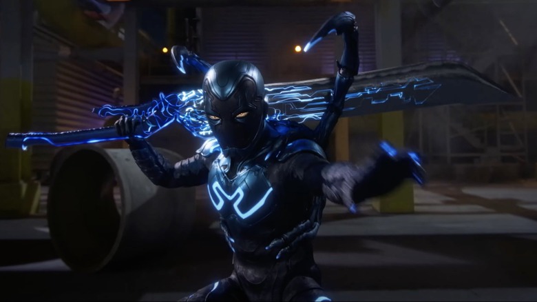 Blue Beetle holding a sword