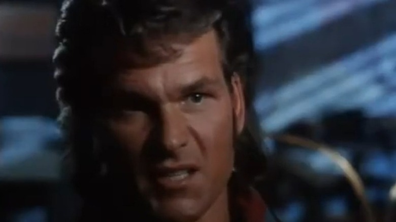 Patrick Swayze scowling