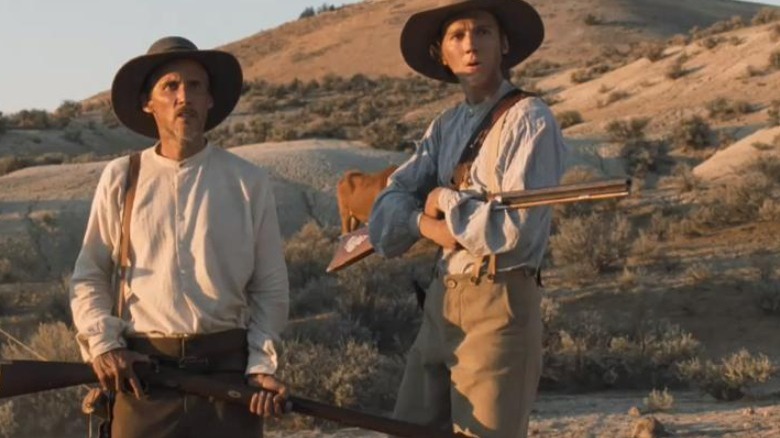Solomon and Thomas holding rifles