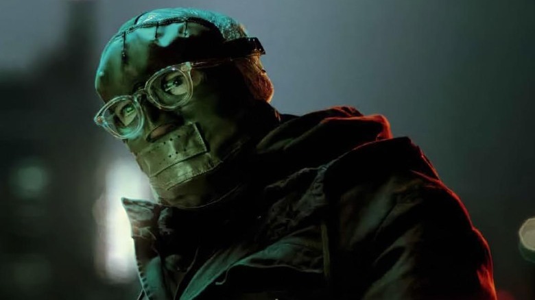 Riddler wearing mask and glasses