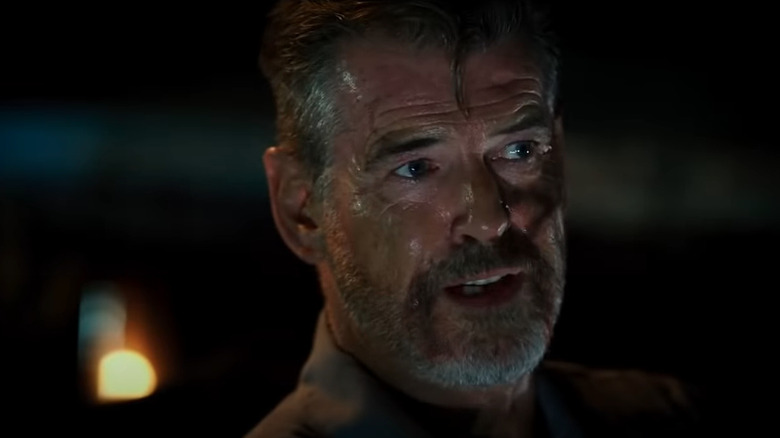 Pierce Brosnan sweaty and bleeding