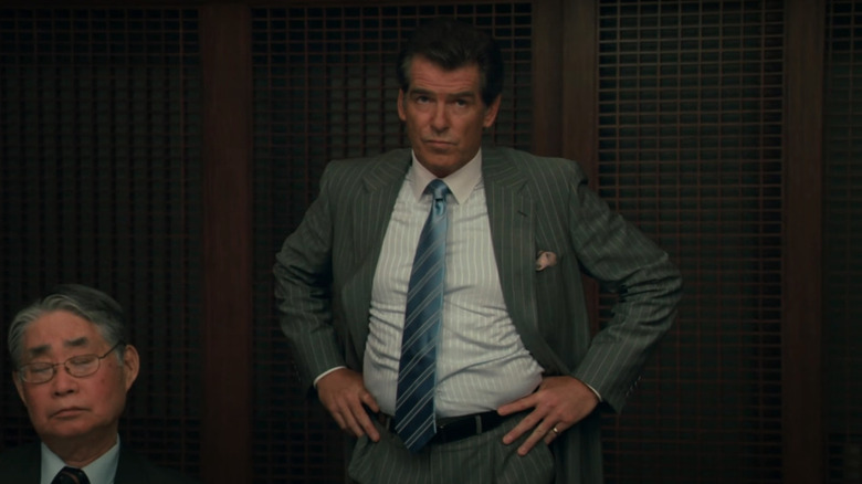 Pierce Brosnan in a boardroom