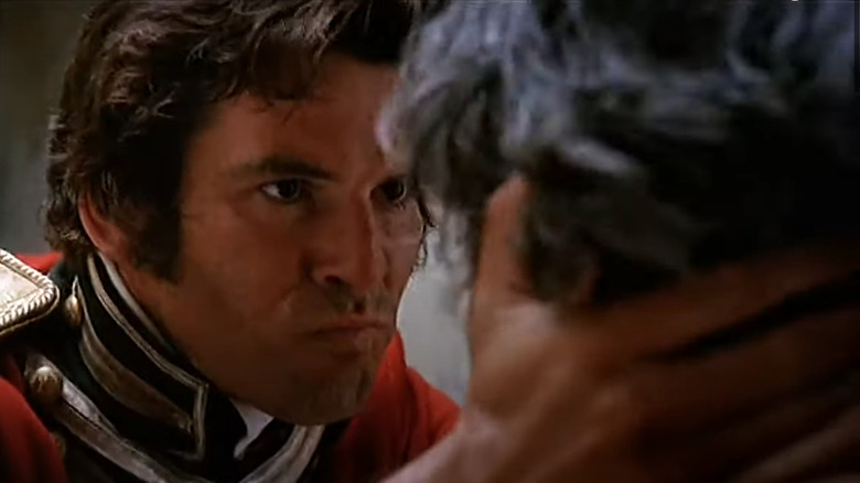 Pierce Brosnan scowling