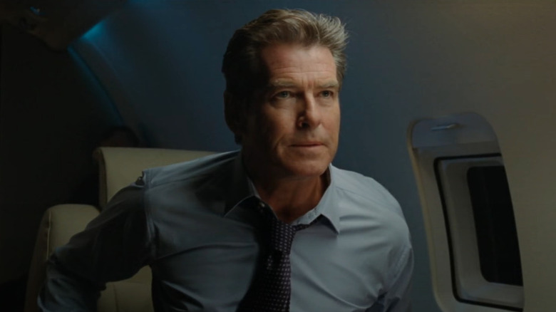 Pierce Brosnan leaning forward