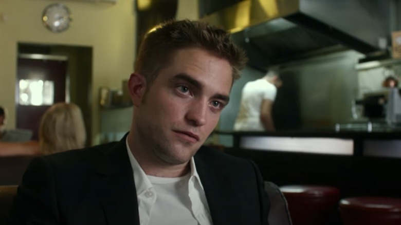 Robert Pattinson sitting