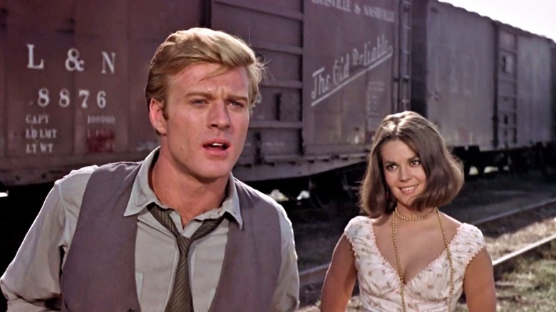 Robert Redford by train tracks 