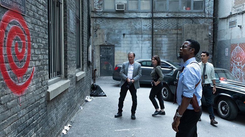 Chris Rock stares at a spiral