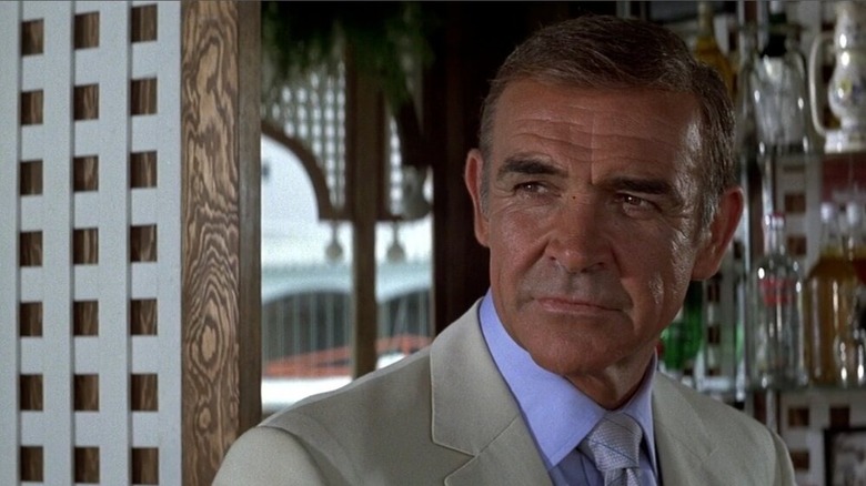 Sean Connery stands at the bar