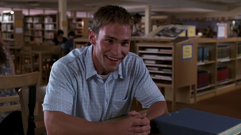 Stifler grinning in library