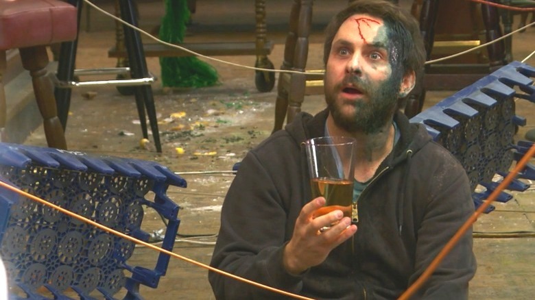 Charlie bleeding, holding beer