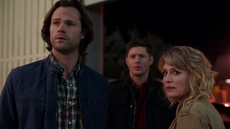 Sam, Dean, and Mary look on solemnly