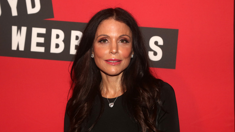 Bethenny Frankel against red backdrop