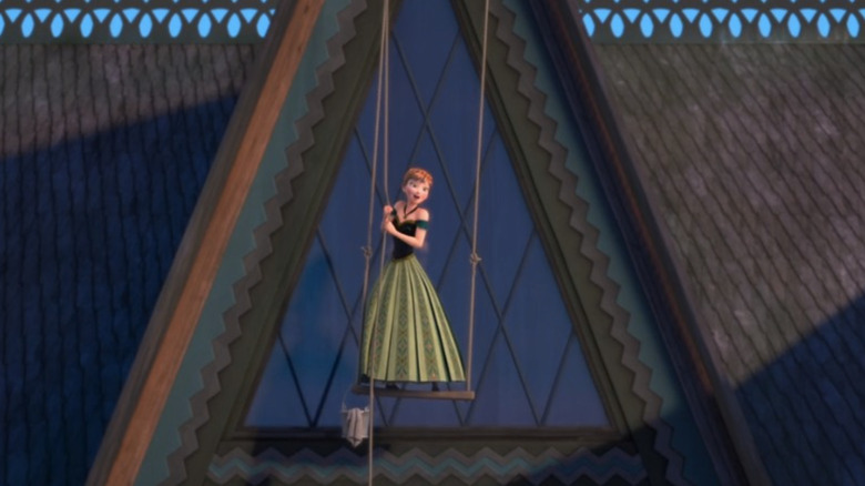 Princess Anna swinging from window maintenance ropes