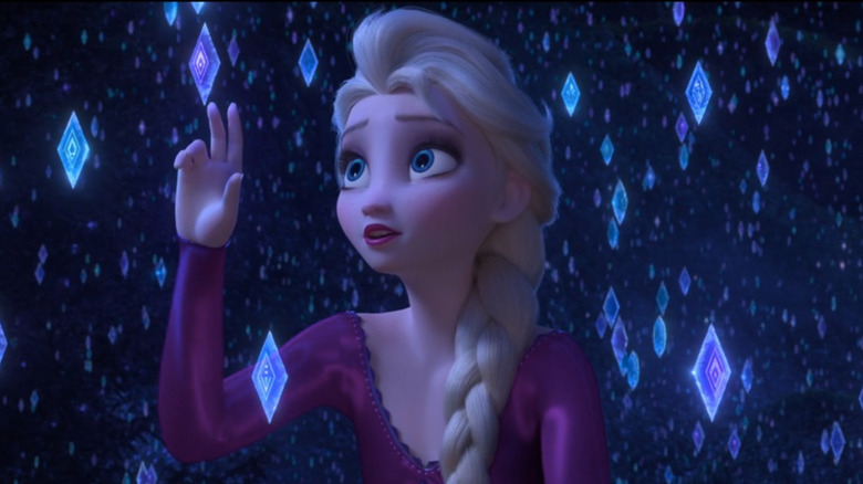 Elsa surrounded by crystals of blue and purple light