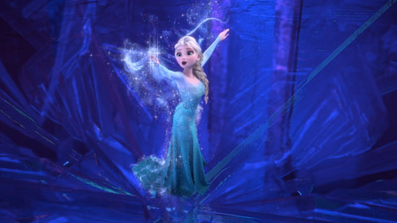 Elsa transforming into her blue dress in her ice palace