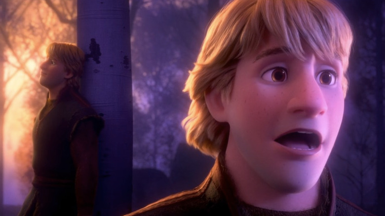 Dramatic close-up of Kristoff in front of Kristoff leaning against tree