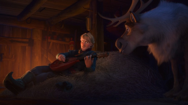 Kristoff lying in hay next to Sven