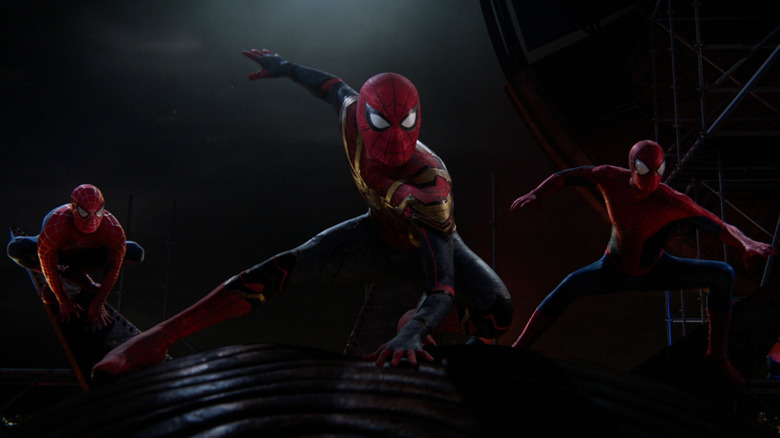 Three live action Spider-Man versions posing