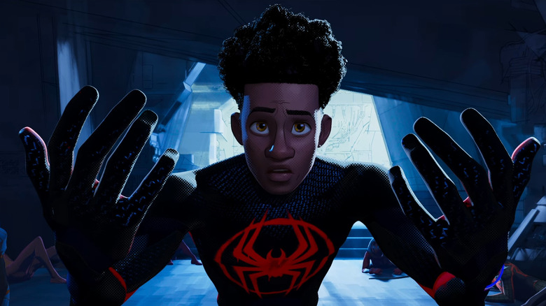 Miles Morales looks at his hands