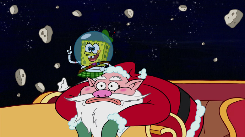 SpongeBob stands while Santa sulks in his sleigh in space