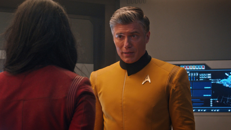 Captain Pike talks to an officer