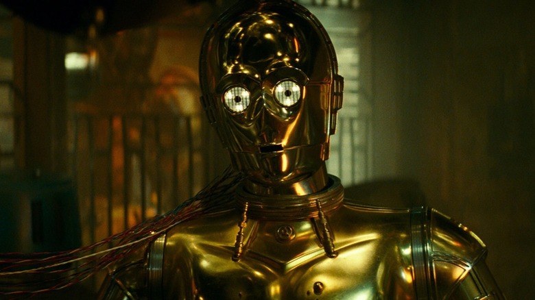 C-3PO plugged in sitting down