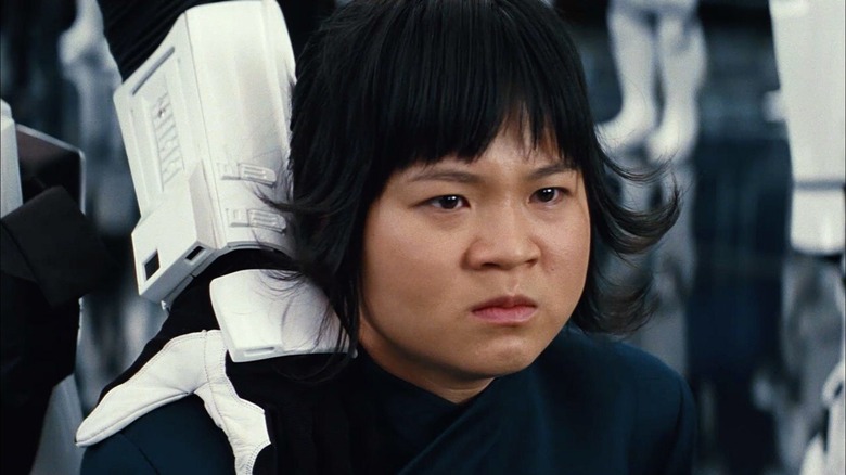 Rose Tico held down by Stormtrooper