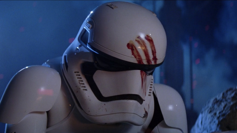 Finn in his blood-stained helmet