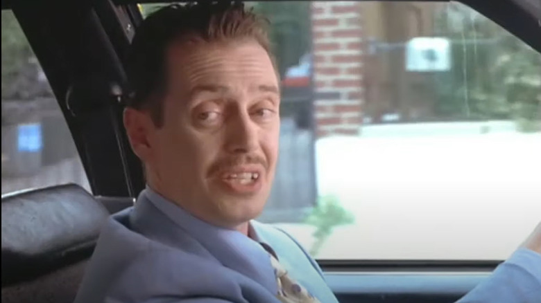 Steve Buscemi drives a car