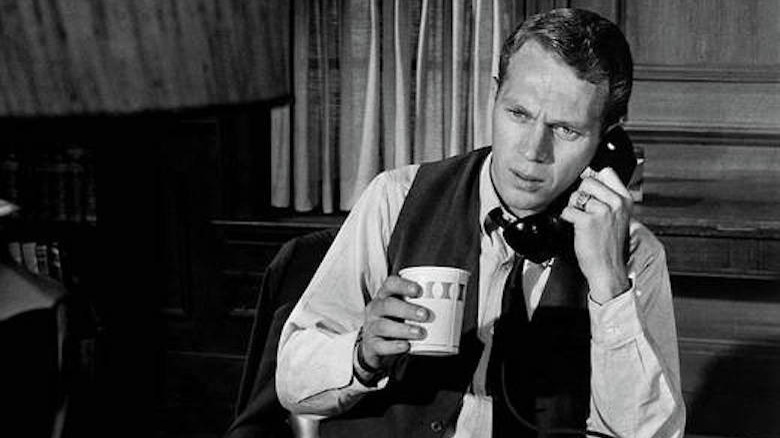 Steve McQueen talks on the phone