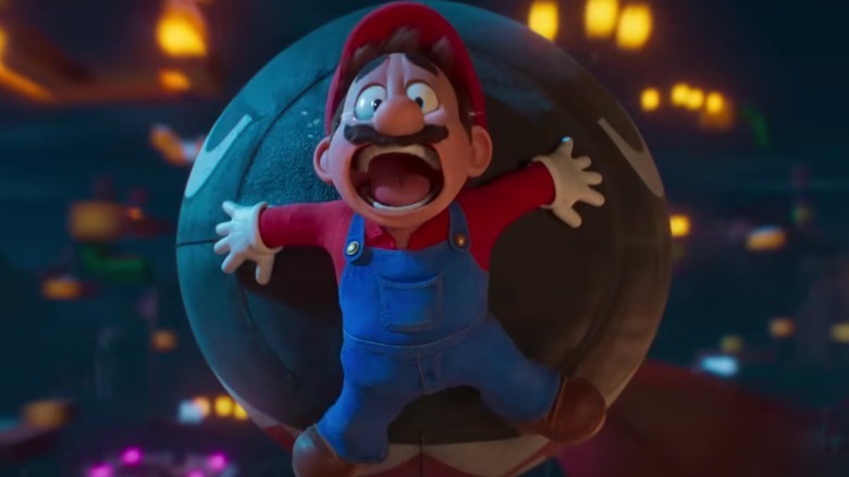 Mario is pushed by Bullet Bill