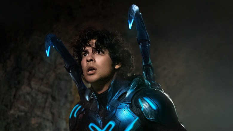 Jaime wears the Blue Beetle suit