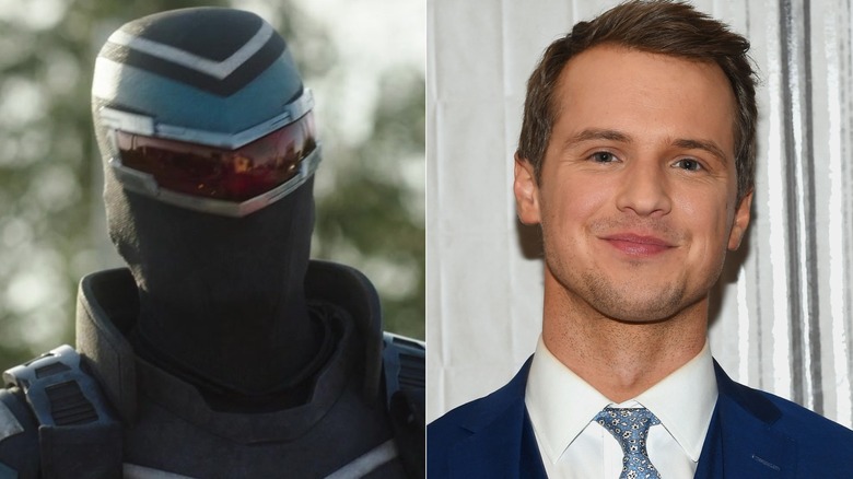 Vigilant standing in full costume and Freddie Stroma smiling in a blue suit in 2017