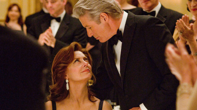 Robert and Ellen at an event in "Arbitrage" (2012)