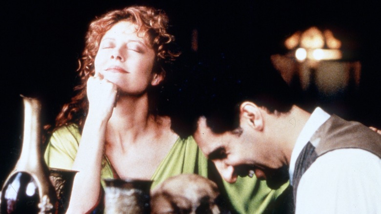 Susan Sarandon eyes closed rests chin on hand John Turturro laughs