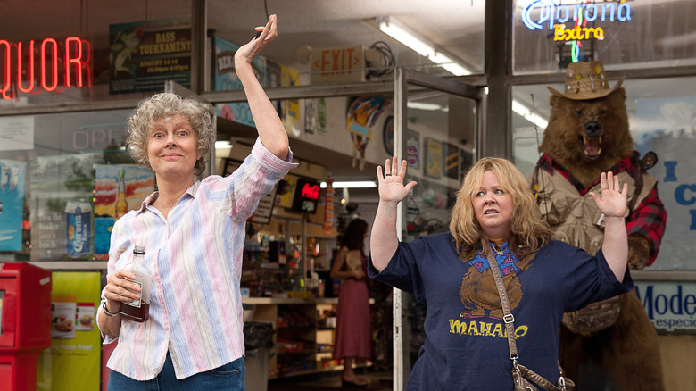 Susan Sarandon and Melissa McCarthy raise arms up