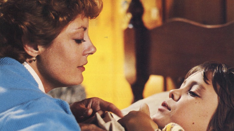 Susan Sarandon looks down at boy in his bed