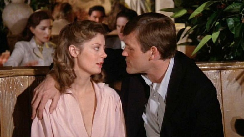 Larry puts his arm around Catherine in "The Other Side of Midnight" (1977)