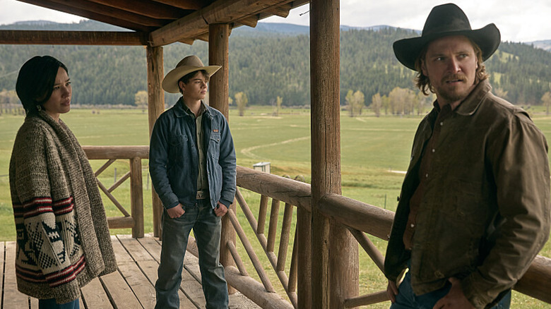 Kayce Monica and Dutton stand on their porch in "Yellowstone"