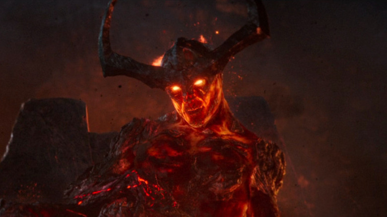 Surtur sitting on throne