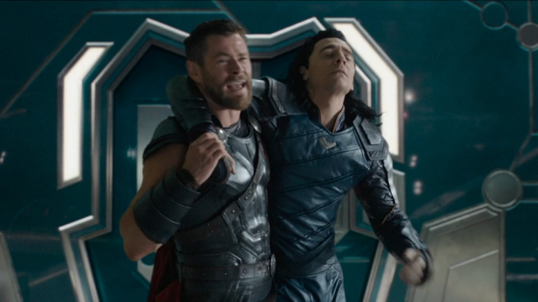 Thor carrying loki get help