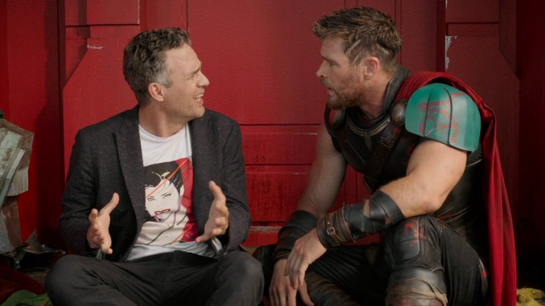 Bruce Banner sitting Thor crouched