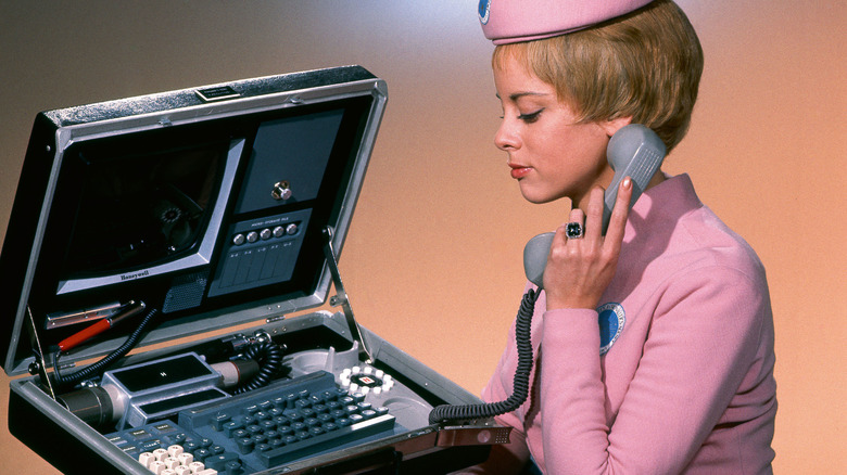 Stewardess using a picturephone