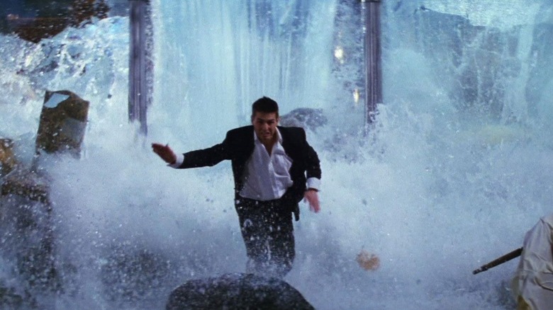 Ethan Hunt runs away from a torrent of water